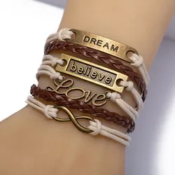Armband FIRETTI "Schmuck Messing Leder DREAM believe Love Infinity Unendlichkeit", grau (messingfarben), Armbänder, Messing-Leder, Messing, Leder, Made in Germany