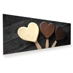 Primedeco Glasbild Wandbild Schokoladeneis in Herzform mit Aufhängung, Süsses braun 150 cm x 60 cm