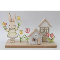 Dekoratives Holzhäuschen mit Hasenfigur und Tulpe