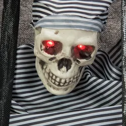 Halloween Figur Knasti - Wand-Dekoration - Totenkopf hinter Gittern - Rot blinke...