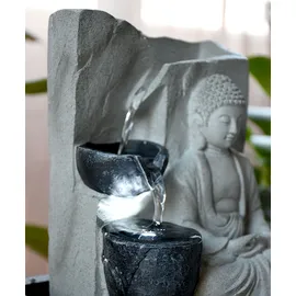GLOBO Tischbrunnen mit Pumpe Springbrunnen mit LED Beleuchtung Buddha Design Zimmerbrunnen grau Dekoration, LxBxH 21x18,5x25,5 cm