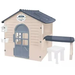 Haus mit Tisch, Stuhl und Vogelhaus