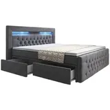 Luxusbetten24 Boxspringbett Menzogna mit LED und Stauraum (2 Schubladen) H2 (bis 70kg) - Grau