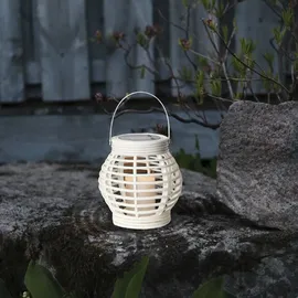 StarTrading STAR TRADING LED Solar Laterne mit LED Kerze in Korboptik Lichtsensor H: 16cm