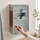 Relaxdays Medizinschrank Emergency Edelstahl / Holz-Optik Hbt:45x30x12cm, 3 Fächer, Glas-Tür abschließbar,silber/braun