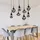 Trio Lumina 8-flg. E14 115 cm oval schwarz matt, chrom bedampft
