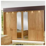 Pharao24 Kleiderschrank Sardanas aus Massivholz, mit LED Beleuchtung braun 307 cm x 220 cm x 58 cm