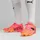 Puma Future 7 Ultimate FG/AG sunset glow/puma black/sun stream 38,5
