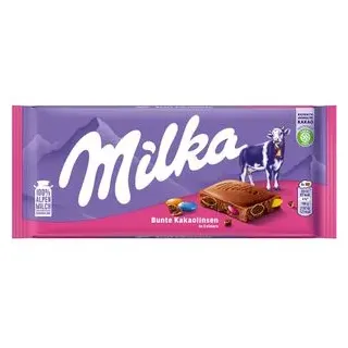 MILKA Alpenmilch Schokolade mit bunten Kakaolinsen 100G