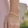 Amor Perlenarmband mit Herzen gelbgoldfarben 17 cm