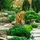 Relaxdays Buddha Figur Garten, wetterfest frostsicher, XL Gartenbuddha ruhend, Gartenfigur, HBT: 61 x 40 x 37 cm, Gold