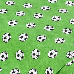 Baumwollstoff Fußball Design, grüngrundig