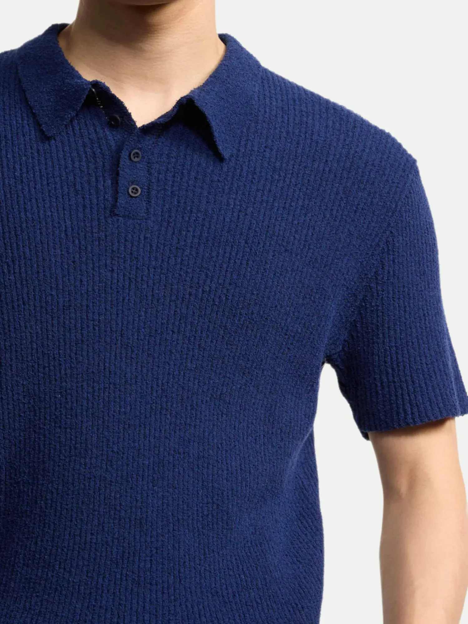 Strickpolo Curyus in Bouclé Blau L