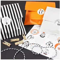 Bow & Hummingbird befüllbarer Adventskalender "Frostige Freunde" zum Befüllen + 50 Füll-Ideen gratis orange|schwarz