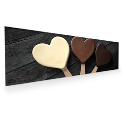 Primedeco Glasbild Wandbild Schokoladeneis in Herzform mit Aufhängung, Süsses braun 120 cm x 40 cm