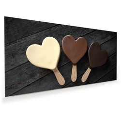 Primedeco Glasbild Wandbild Schokoladeneis in Herzform mit Aufhängung, Süsses braun 60 cm x 30 cm