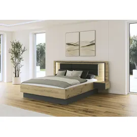 Rauch Bettanlage RAUCH "Bett Doppelbett Komortbett BILBAO-EXTRA", braun (eiche artisan, graumetallic), B:245cm H:109cm T:207cm, Holzwerkstoff, Schlafzimmermöbel-Sets, Bettgestell, Polster-Kopfteil in Lederoptik basalt, mit Beleuchtung MADE IN GERMANY