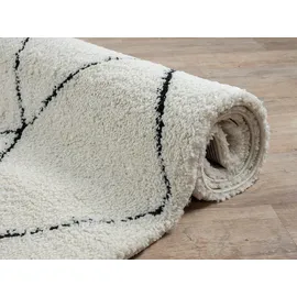 The CarPET Velvet eleganter Designer Teppich Wohnzimmer, weicher & pflegeleichter Hochflor Wohnzimmerteppich in Creme-Schwarz 80 x 150 cm
