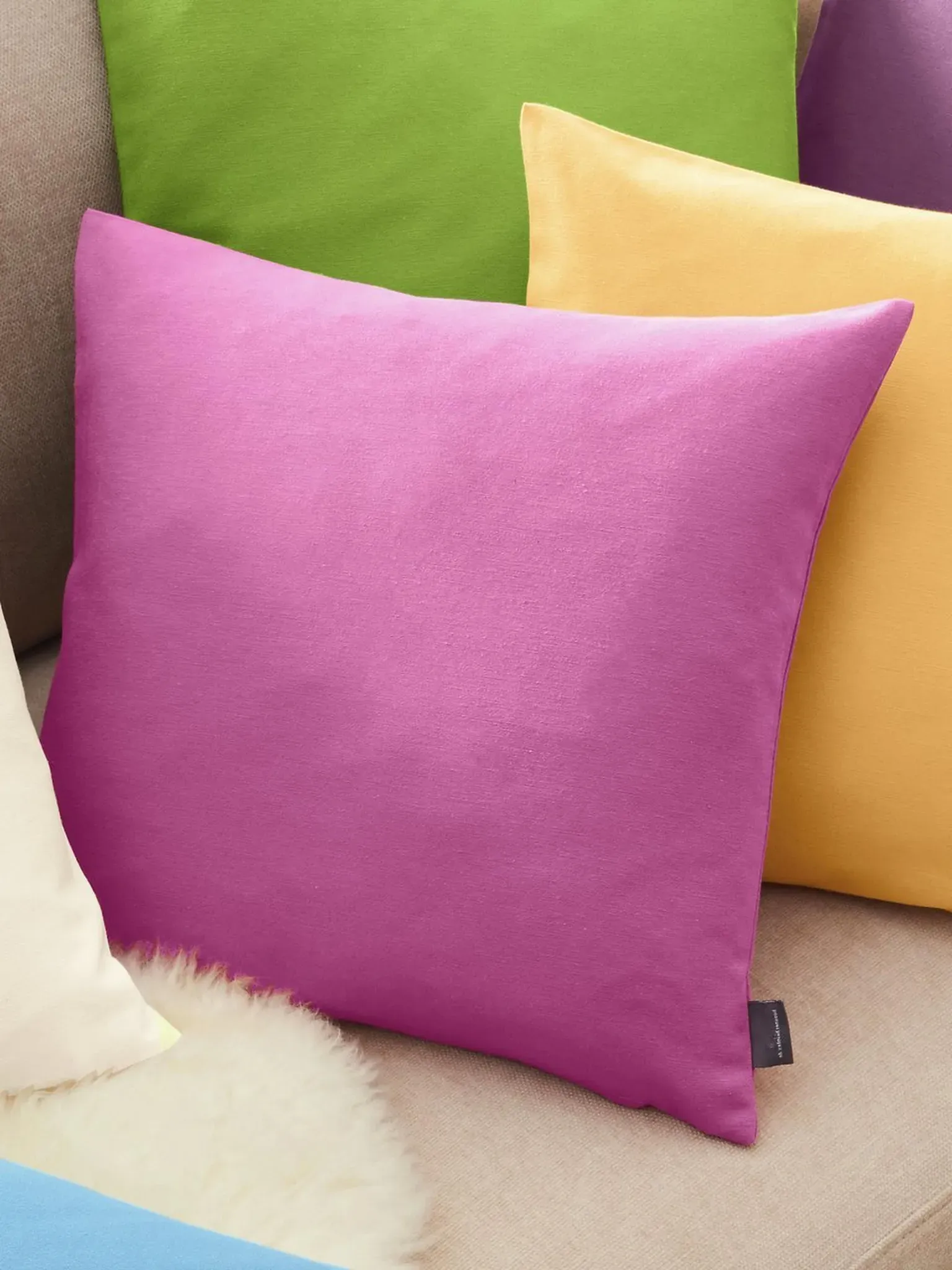 La housse coussin  Hossner fuchsia